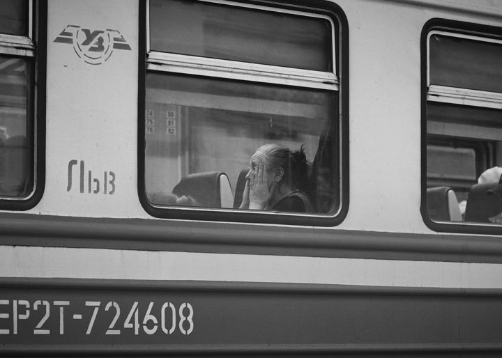 Refugee coming to the Uk through the window of a train